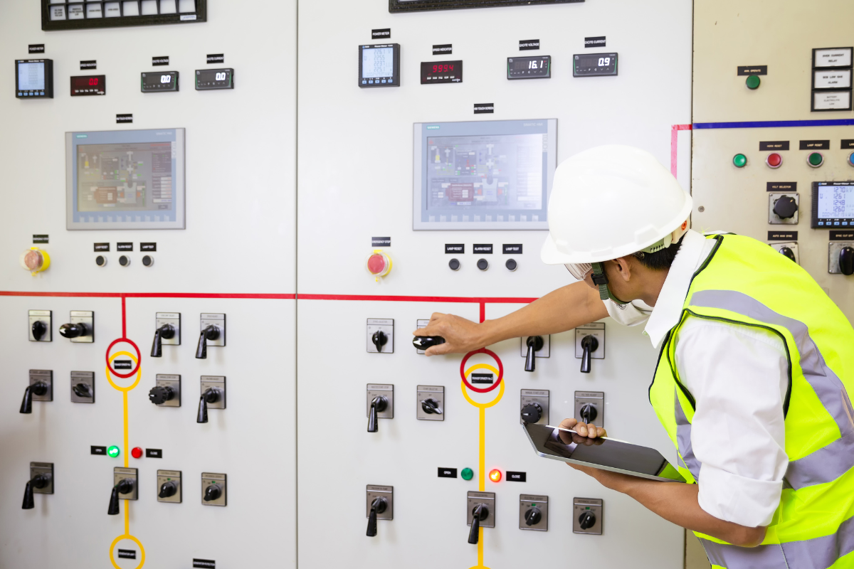 An engineer adjusting building controls.