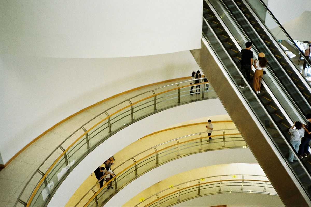 People moving inside a big commercial property. 
