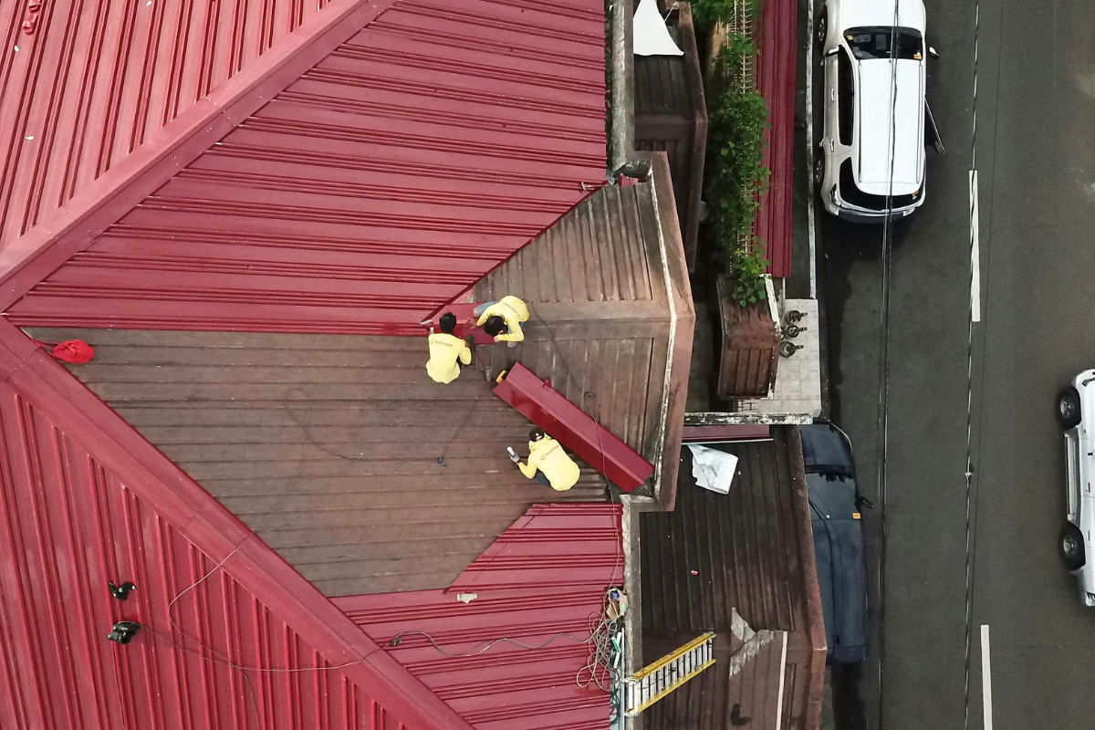 Maintenance on the roof of a building.