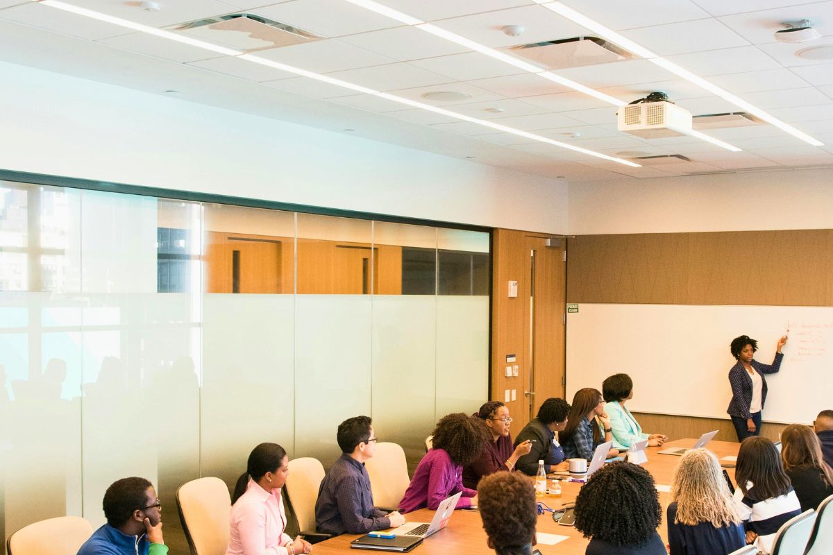 Productive meeting in a modern office with energy-efficient plant and equipment.