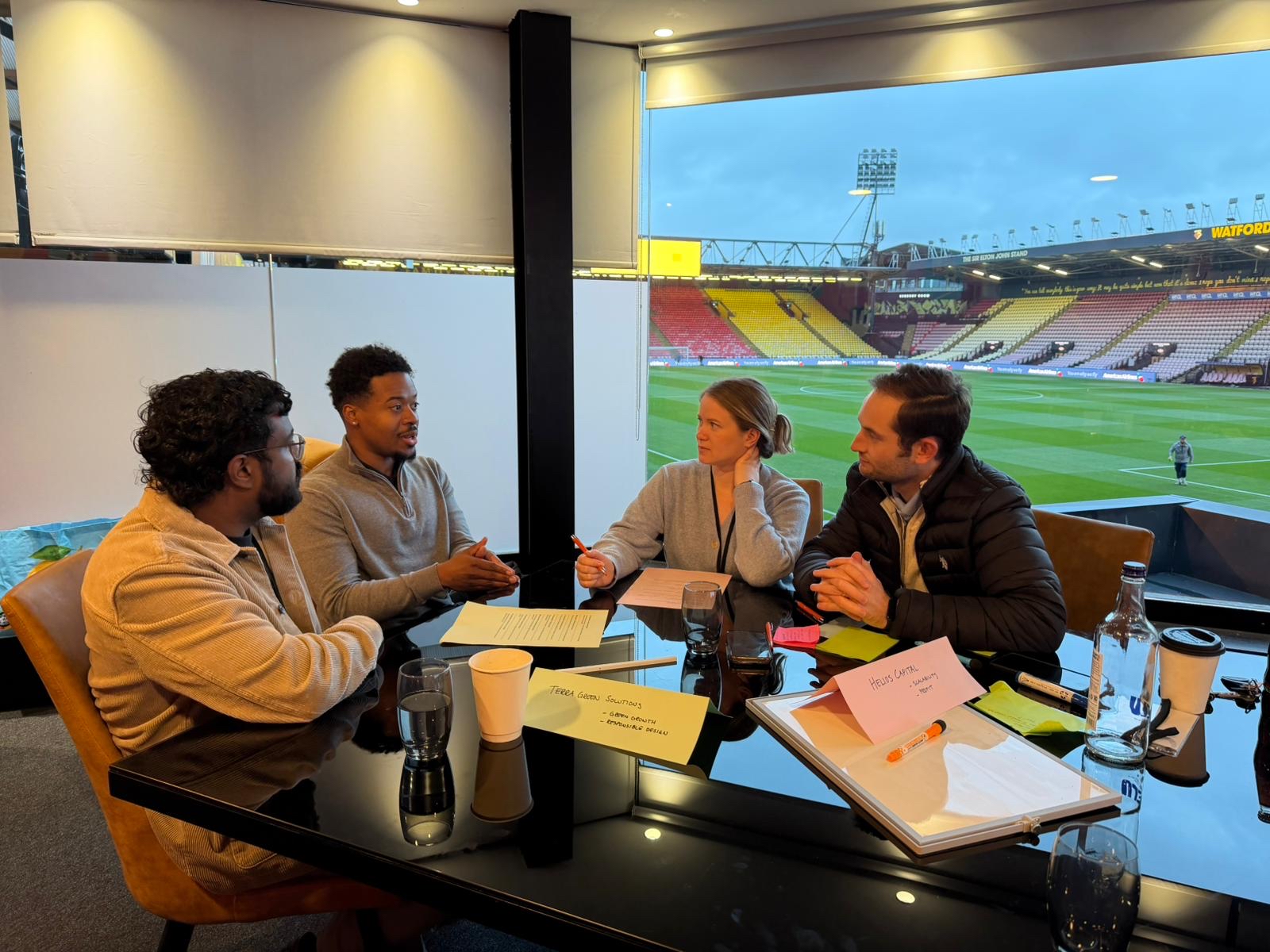 Karsons Consulting team working together during teamship challenge at Watford Stadium