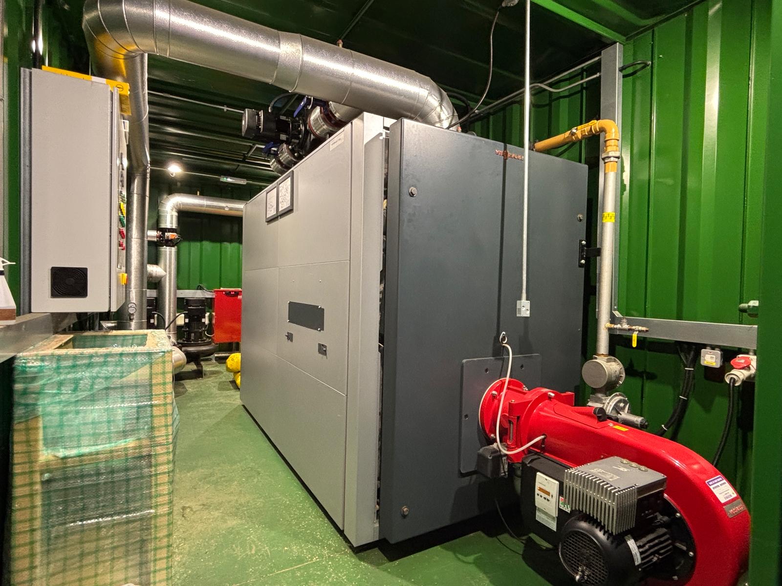 Karsons team exploring mechanical plant rooms and under-pitch heating systems at Watford Stadium